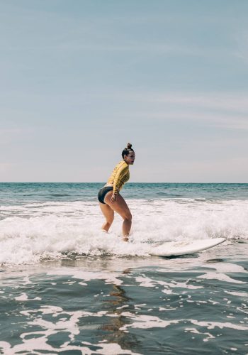 high waves and a surfing girl